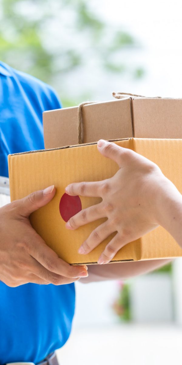 woman-hand-accepting-delivery-boxes-from-deliveryman